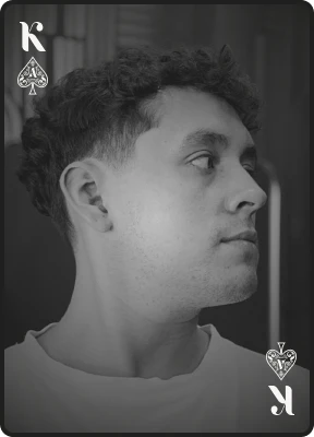 King of Spades card illustrating a men's haircut service featuring textured hair and faded sides.